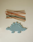 Mushie Silicone Sensory Toy and colored straws for fidget or fine motor play fun.