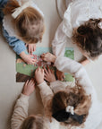 kids playing with sticker book