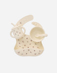 Rylee + Cru Feeding Kit Heart Ditsy: floral silicone bib, suction bowl, cup with straw, spoon.
