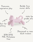 The mushie Cat Figurine Teether is a pink, cat-shaped silicone teether designed for back molars. BPA/BPS/PVC/phthalate free, it encourages imaginative play and fine motor skills—perfect for little ones.