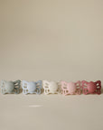 FRIGG Butterfly Anatomical Silicone Pacifier 2-Pack (0-6M) in pastel tones on display.