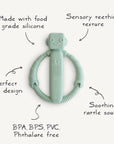 The mushie Robot Rattle Teether is a light green, robot-shaped baby teething toy made from food-grade silicone with sensory textures, an easy-grip design, soothing rattle sound, and free of BPA, BPS, PVC, and phthalates.