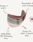 Mushie Whale Bath Stackers feature pastel colors and a "Made in Denmark" seal.