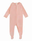 The mushie Zipper Pajama is a light pink, long-sleeved baby onesie with covered feet and a front zipper, ideal as cozy footed pajamas, shown on a white background.