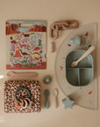 flatlay with feeding and sticker book