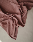 Lifestyle image of Organic Cotton Swaddle, Cedar