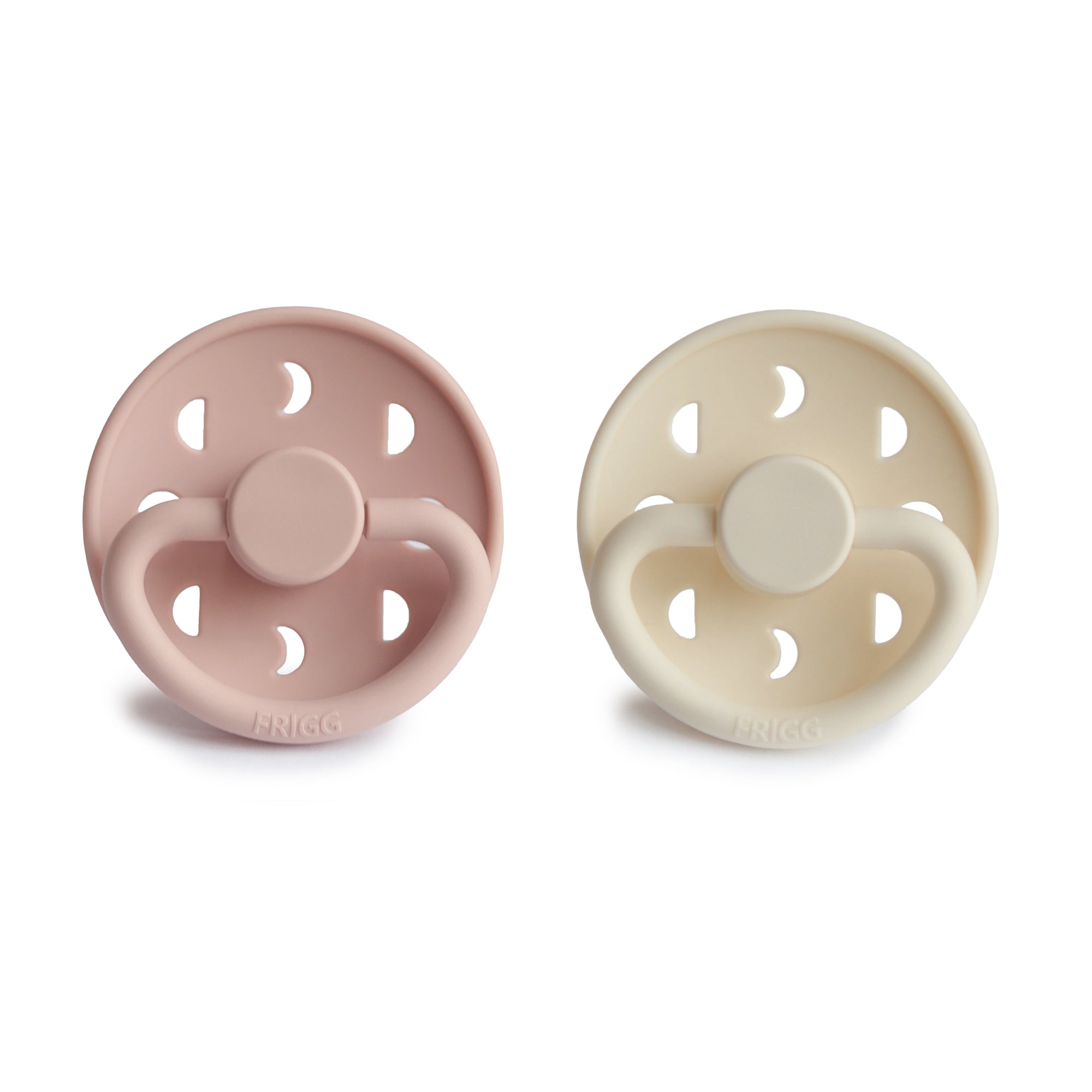 Front view of Blush and Cream Moon Silicone Frigg pacifiers.