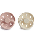 Front view of Blush and Cream Moon Silicone Frigg pacifiers.