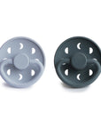 Front view of Powder Blue and Slate Moon Silicone Frigg pacifiers.