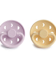 Front view of Soft Lilac and Pale Daffodil Moon Silicone Frigg pacifiers.