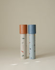 Two mushie Kaleidoscopes for kids, ideal for imaginative play on a neutral background.