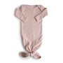 Blush-colored organic cotton Ribbed Knotted Baby Gown with a knotted hem.