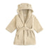 Wrap your toddler in cozy comfort after bath time with the mushie Bear Robe in Fog—a soft hooded robe with adorable bear ears, long sleeves, and a fabric belt at the waist.