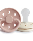 FRIGG Moon Silicone Pacifier 2-Pack in pink and white, upright on a white background.