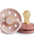 FRIGG Moon Natural Rubber Pacifier 2-Pack in pink shown on a white background.