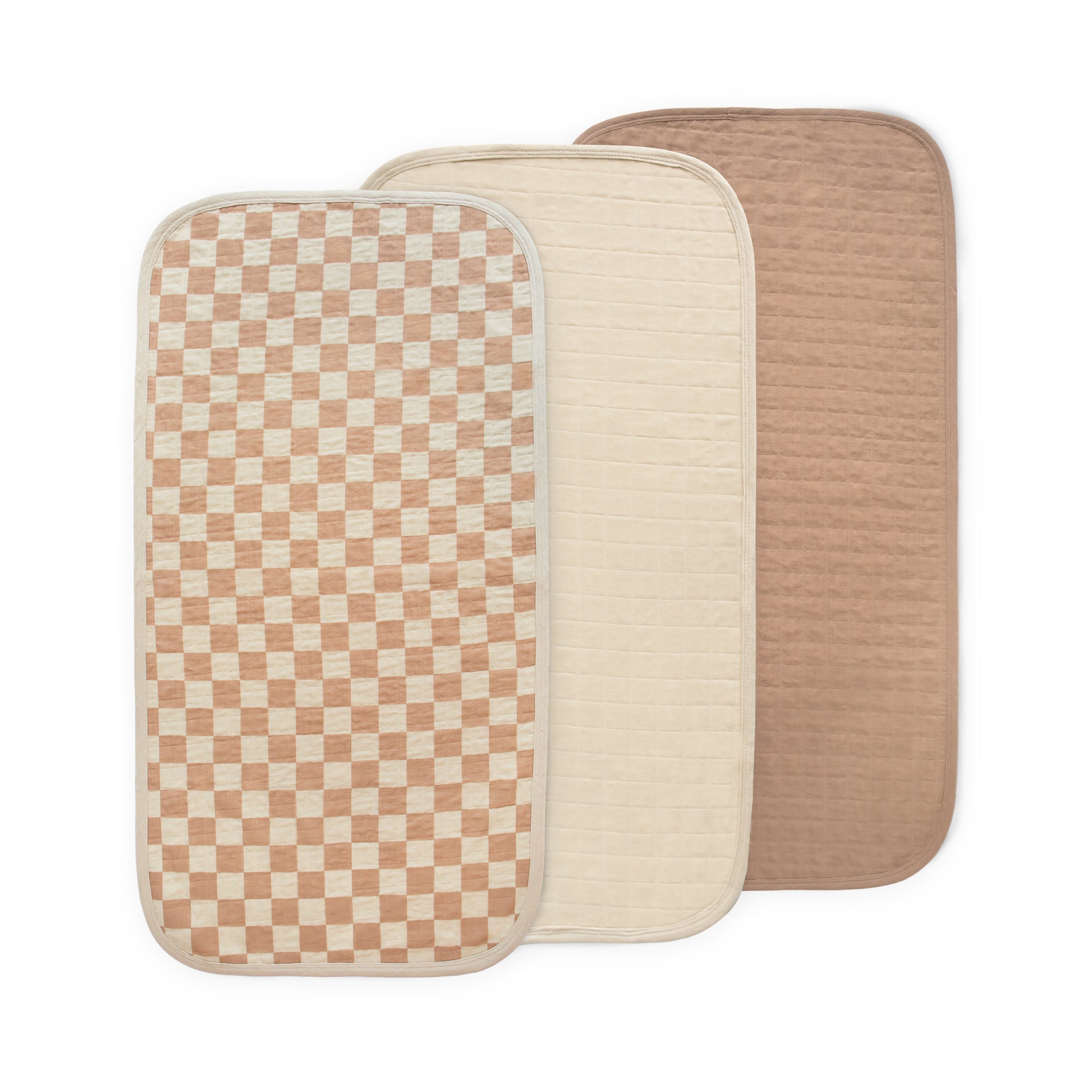 Set of 3 Mushie Changing Pad Liners in cream, checkered, and light brown organic cotton.