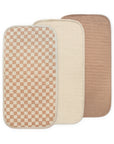 Set of 3 Mushie Changing Pad Liners in cream, checkered, and light brown organic cotton.