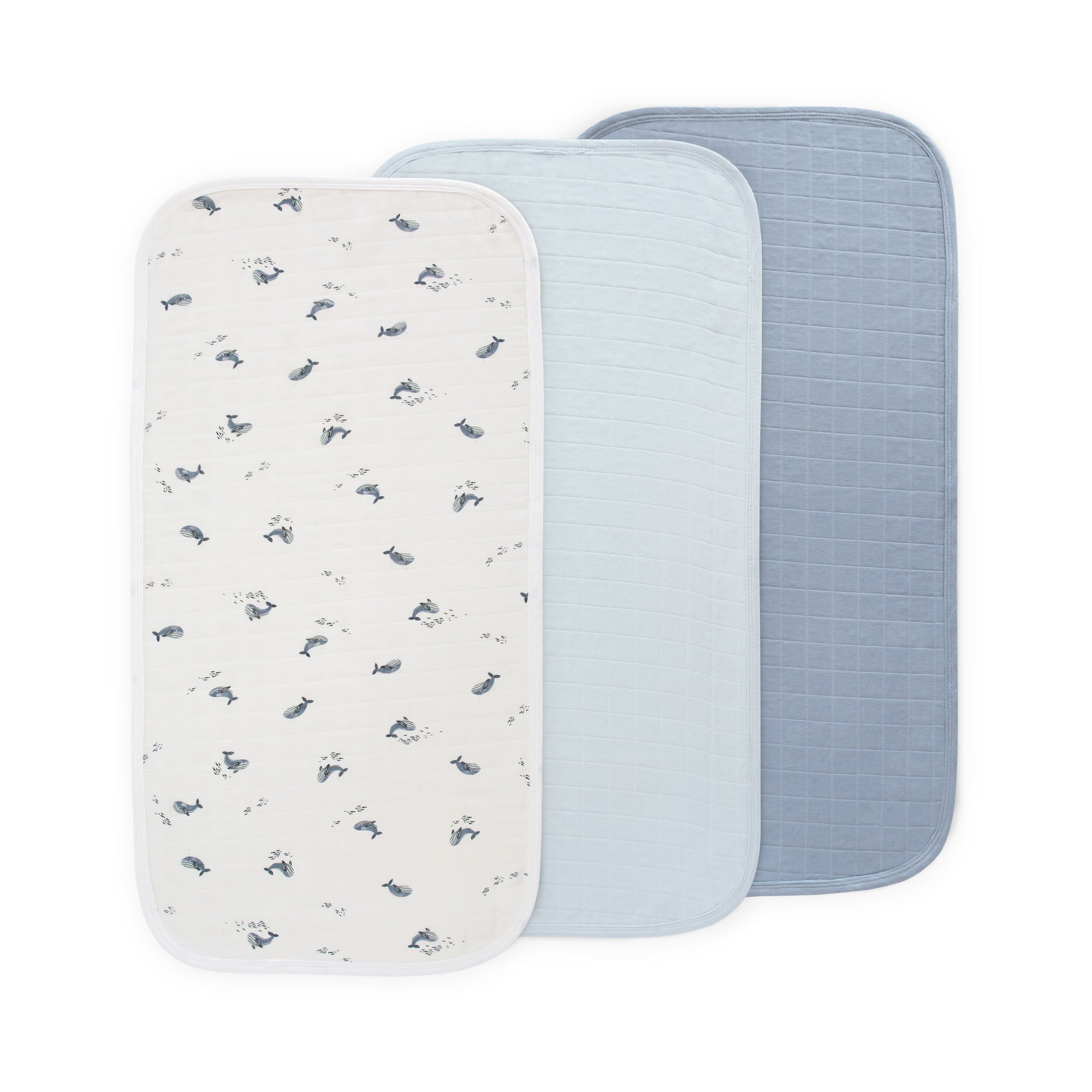 Three Mushie Changing Pad Liners: water-repellent, light blue, and dark blue.