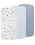 Three Mushie Changing Pad Liners: water-repellent, light blue, and dark blue.