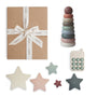 The mushie Everyday Play Gift Set ($48 value) includes a brown gift box with a white ribbon, stackable pastel rings, a toy phone, and five star-shaped sensory toys—perfect for supporting baby's fine motor skills.