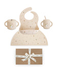 Mushie Hanukkah Doves Feeding Kit with a silicone bib, placemat, and cups above a gift box.