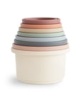 Mushie Stacking Cups Toy—pastel nesting cups for babies, displayed on a white background.