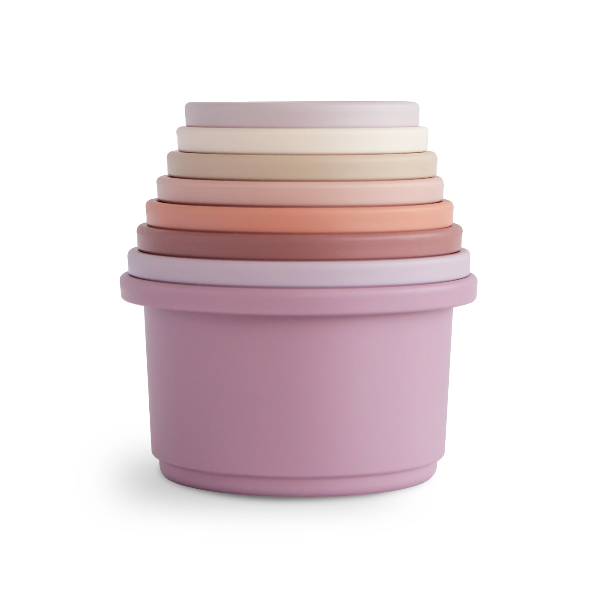 Six pastel mushie Stacking Cups nest from purple to white, inspired by Danish Hygge toys.