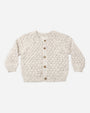 Rylee + Cru Bubble Knit Cardigan Natural Confetti, cream with brown buttons, laid flat on white.