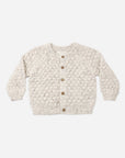 Rylee + Cru Bubble Knit Cardigan Natural Confetti, cream with brown buttons, laid flat on white.