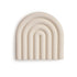 The mushie Rainbow Teether is a beige, rainbow-shaped silicone baby teether with rounded arches and the mushie logo embossed on the lower right, part of our popular Rainbow Teethers collection. Set against a white background. Non-toxic for safe use.