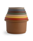 Mushie Stacking Cups Toy: seven stacked cups evoke Hygge, a cozy baby toy on white background.