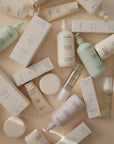 Mushie Baby Body Lotion with natural ingredients and packaging featuring bottles and boxes.