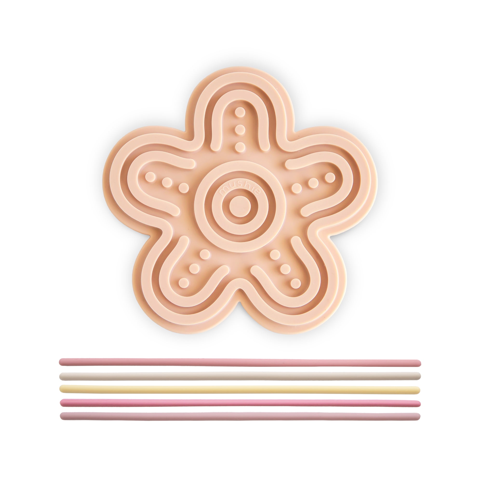 Mushie Silicone Sensory Toy: flower-shaped with five grooves and pastel sticks for motor play.