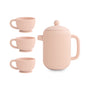 The Mushie Silicone Tea Play Set features a blush pink ribbed design with a lidded teapot and three matching footed teacups, all with a matte finish—perfect for pretend play in any play kitchen.