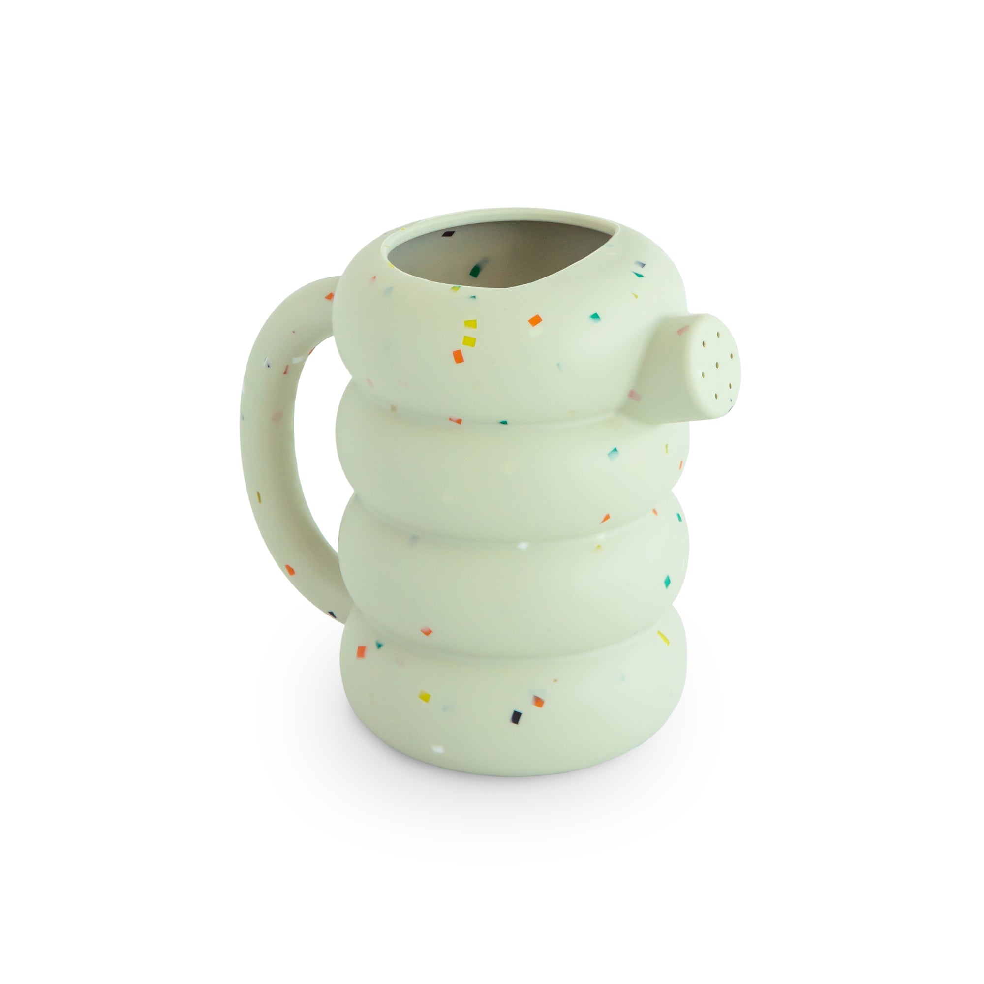 Mushie Silicone Watering Can: round, white, speckled; thick handle resembles a bath toy.