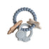 The mushie Space Teething Ring is made from food grade silicone in blue, beige, and cream, with beaded rings and star, astronaut, and spaceship charms to support your baby's sensory development.