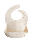 Mushie Silicone Baby Bib, cream with stars, adjustable neck & easy to clean.