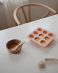 Mushie Baby Food Freezer Tray in pink, BPA-free silicone, perfect for baby food storage.