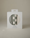 Three Mushie Changing Pad Liners in a white box with a circular window on the front.