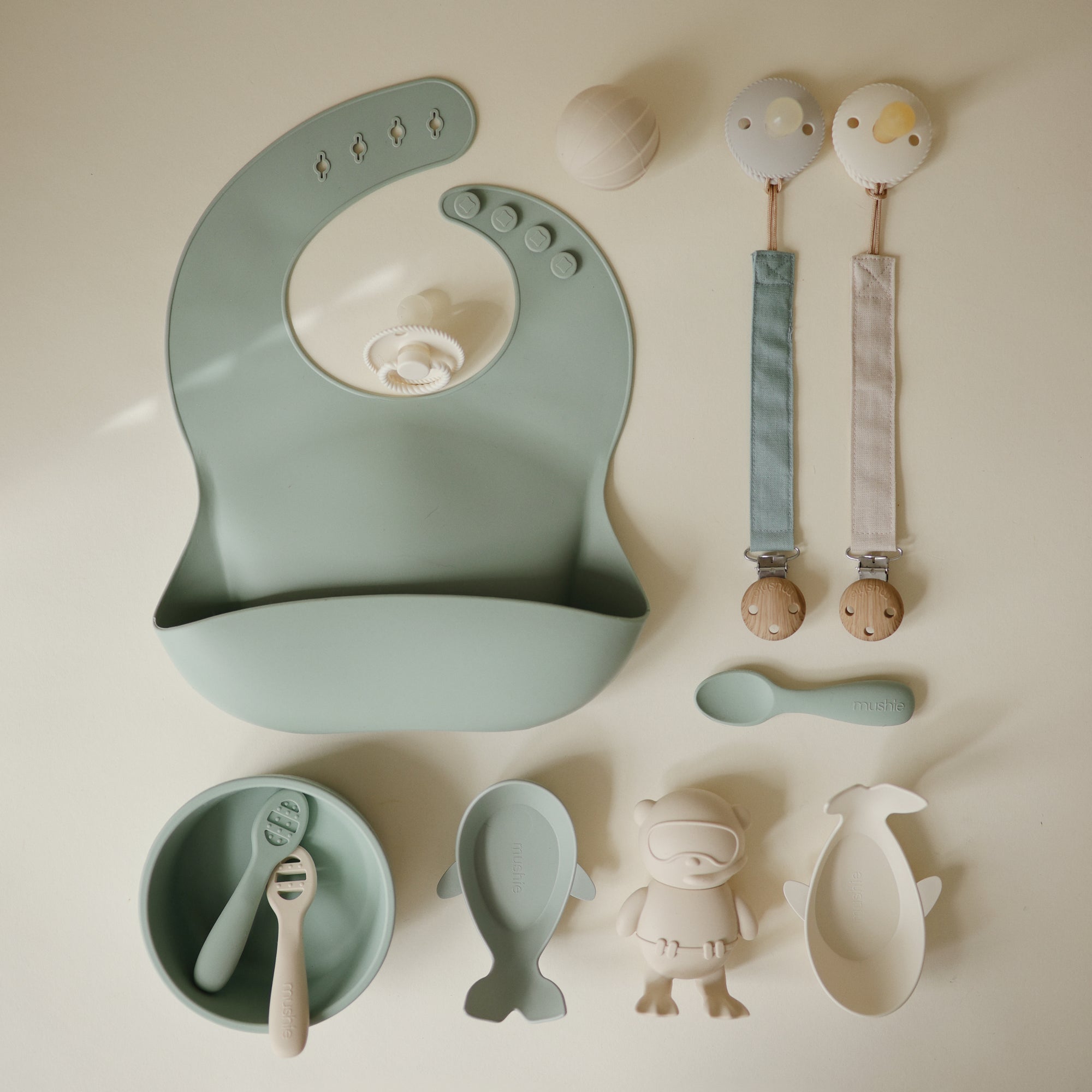 Mushie Linen Pacifier Clip 2-Pack, soft pastel style, perfect for baby’s feeding essentials.