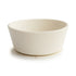 The mushie Silicone Suction Bowl, featuring a round off-white design with smooth sides and a flared rim, is perfect for baby feeding and sits on a white surface.