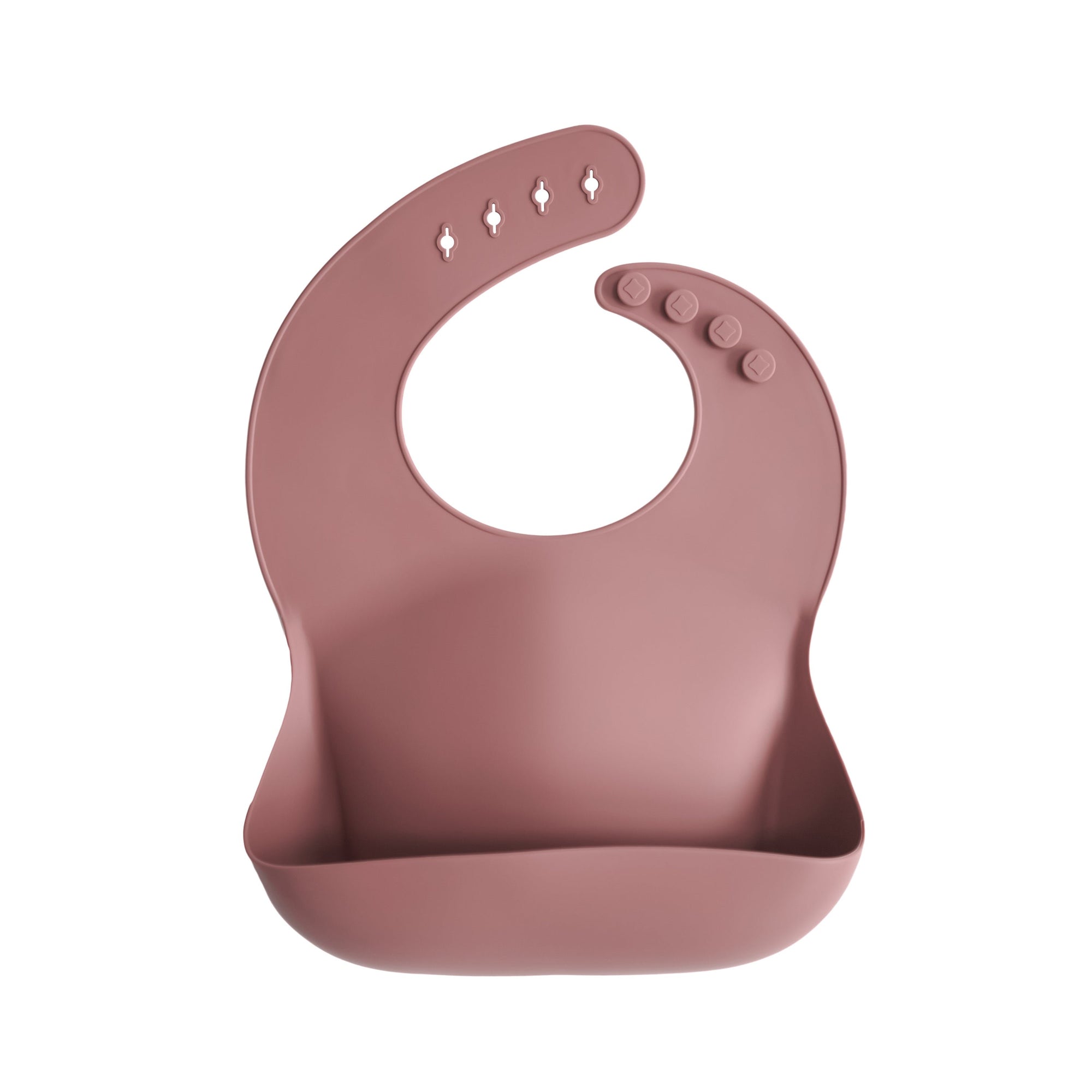 Mushie Silicone Baby Bib in pink with front pocket, adjustable buttons, and easy-to-clean design.