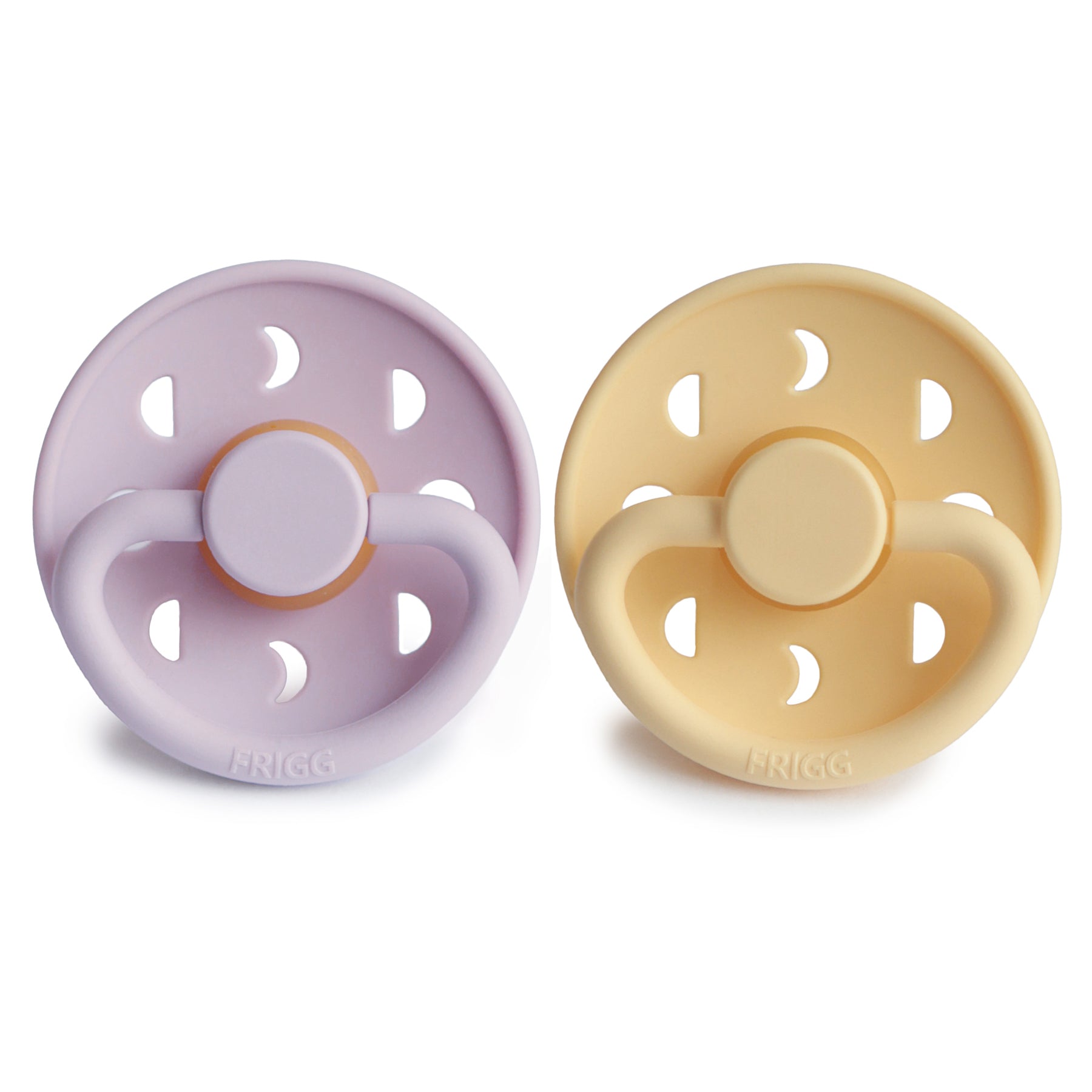 FRIGG Moon Natural Rubber Pacifier 2-Pack in lavender and beige, with cutouts and a knob.