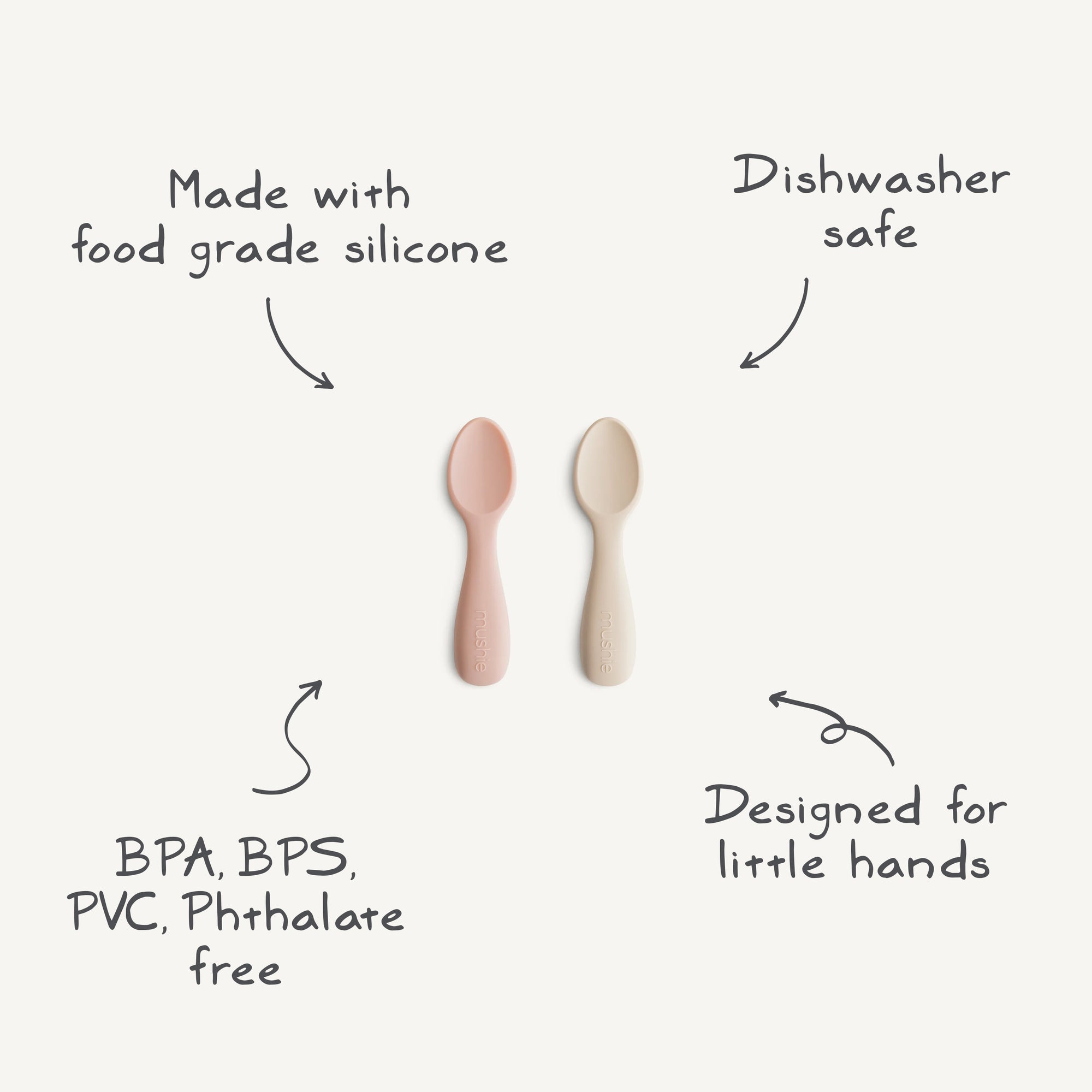 Two mushie Silicone Toddler Starter Spoons—one pink, one beige—are displayed on a white background. Made with food-grade silicone, they're BPA/BPS/PVC/phthalate free, dishwasher safe, and ideal for toddlers learning to self-feed.