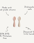 Two mushie Silicone Toddler Starter Spoons—one pink, one beige—are displayed on a white background. Made with food-grade silicone, they're BPA/BPS/PVC/phthalate free, dishwasher safe, and ideal for toddlers learning to self-feed.