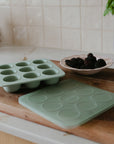 Mushie Baby Food Freezer Tray: light green, BPA-free silicone with lid for storage and baking.