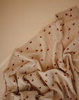 Lifestyle image of Organic Cotton Swaddle in Butterflies