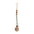 The mushie Silicone Pacifier Clip | Eva is made from food-grade silicone and wood, with a looped cord, four wooden beads, five pale green beads, and a round wooden clasp—ideal for chic pacifier accessories.