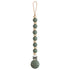 The mushie Silicone Pacifier Clip | Luna is a stylish baby accessory with alternating green and beige food-grade silicone beads, a secure top loop, and a green clip for easy attachment.