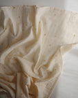 Lifestyle image of Organic Cotton Swaddle in Suns